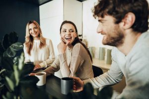 Coworkers share a coffee break.